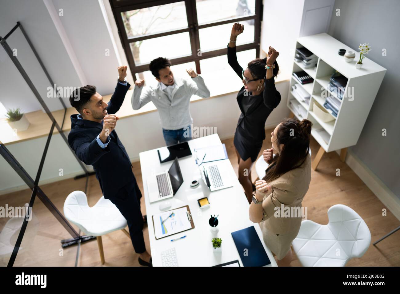 Multi Racial Business People Group Celebrate And Cheer Stock Photo