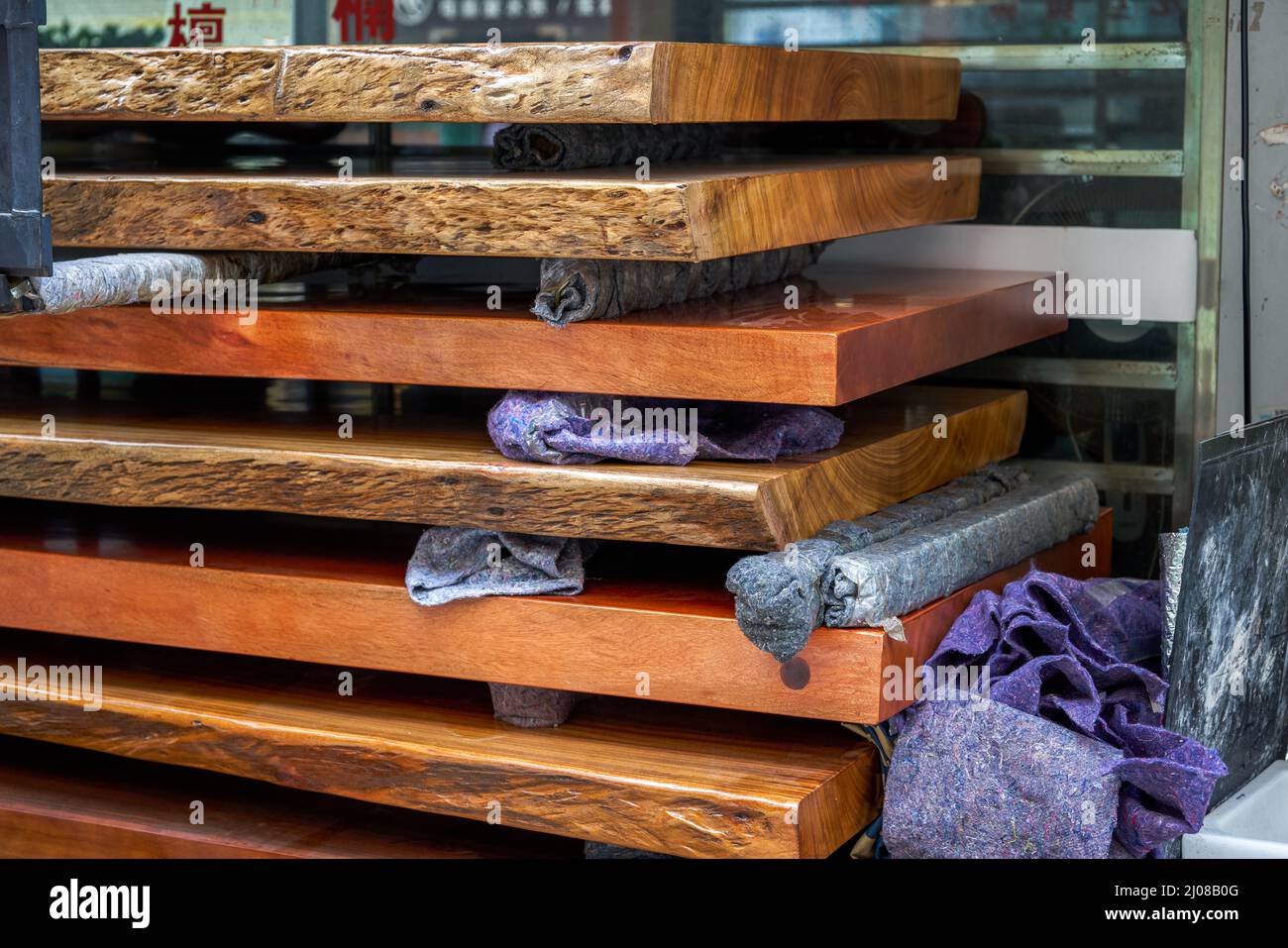 Mahogany planks and mahogany table tops for sale in the market Stock Photo Alamy