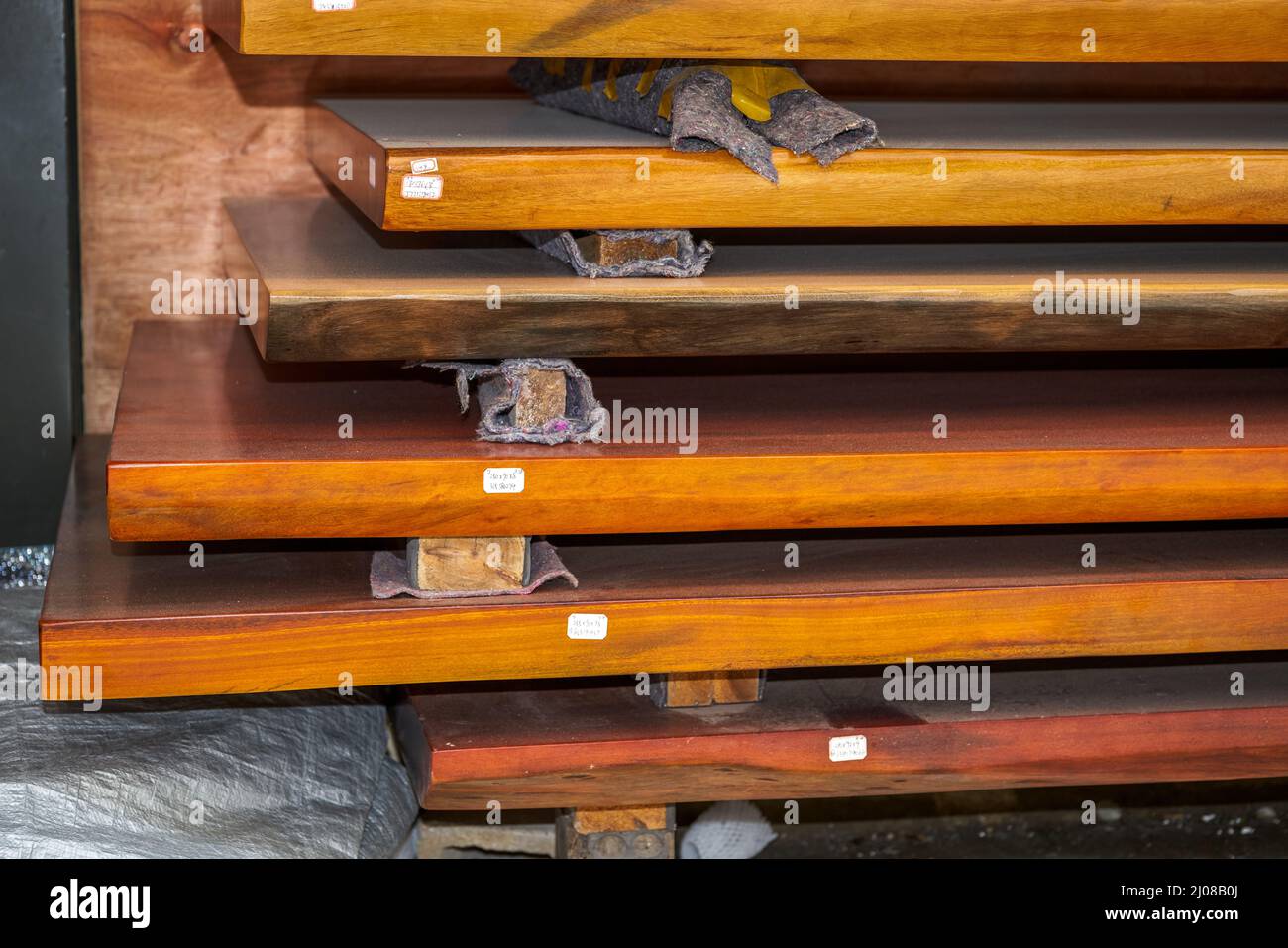 Mahogany planks and mahogany table tops for sale in the market Stock Photo Alamy