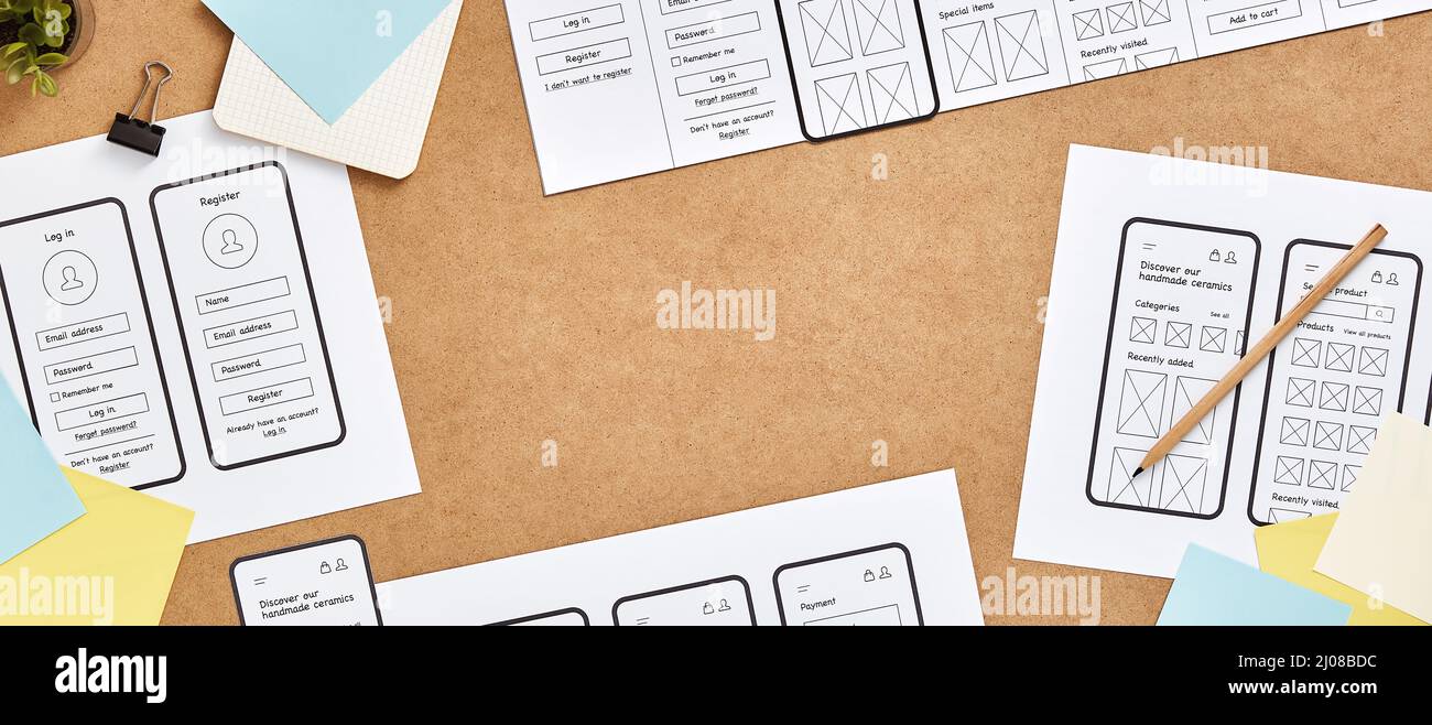 Mobile responsive website project concept web banner. Top view image of web UX designer workspace with mobile app wireframe sketches and copy space. Stock Photo