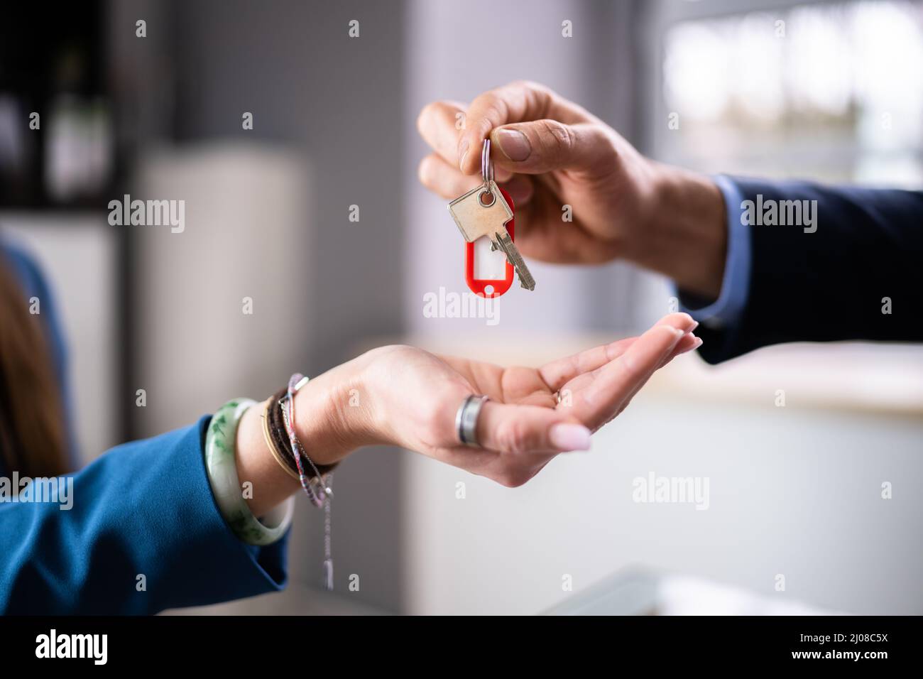 Real Estate House Sale Key Handover . Property Ownership Stock Photo
