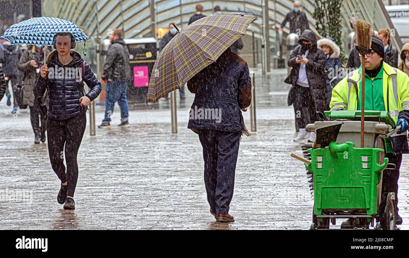 Glasgow, Scotland, UK 17th March, 2022. UK  Weather: : Rainy day saw summer like weather disappear as April showers arrived early to the applause of umbrellas in the city centre. Credit Gerard Ferry/Alamy Live News Stock Photo