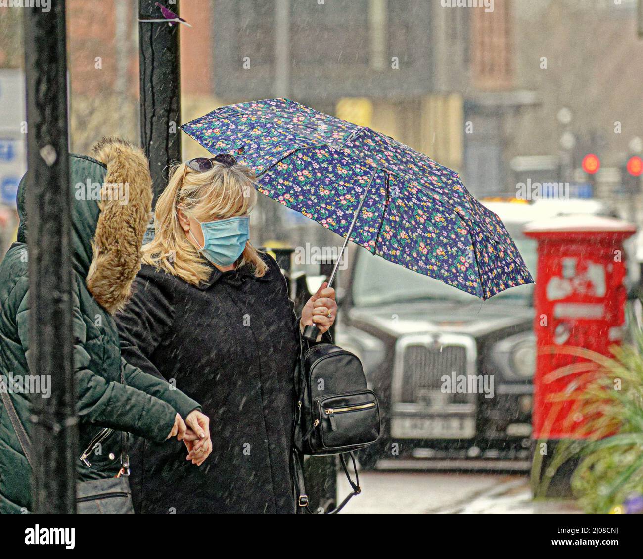 Glasgow, Scotland, UK 17th March, 2022. UK  Weather: : Rainy day saw summer like weather disappear as April showers arrived early to the applause of umbrellas in the city centre. Credit Gerard Ferry/Alamy Live News Stock Photo