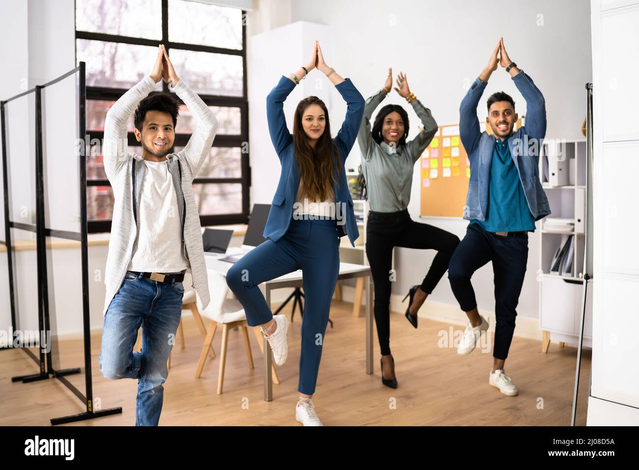 Business People Exercising In Office. Corporate Workout Stock Photo