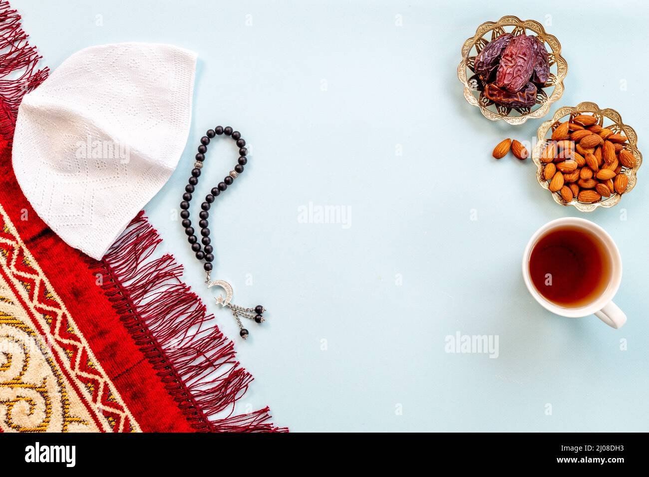 Ramadan background - Islamic prayer carpet with dates and rosary Stock