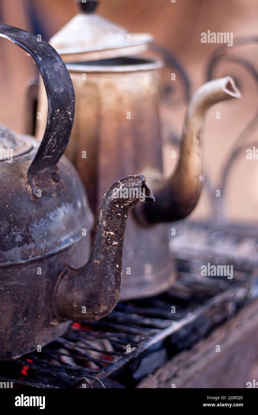 Two old rusty teapots of nomadic people of southern deserts of Morocco
