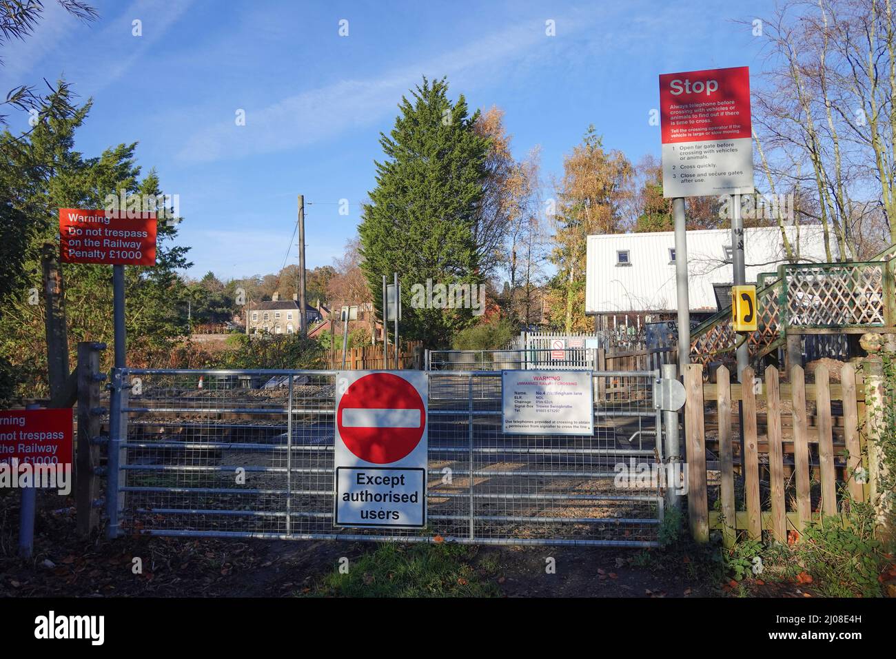 Typical unmanned railway level crossing in the UK Stock Photo