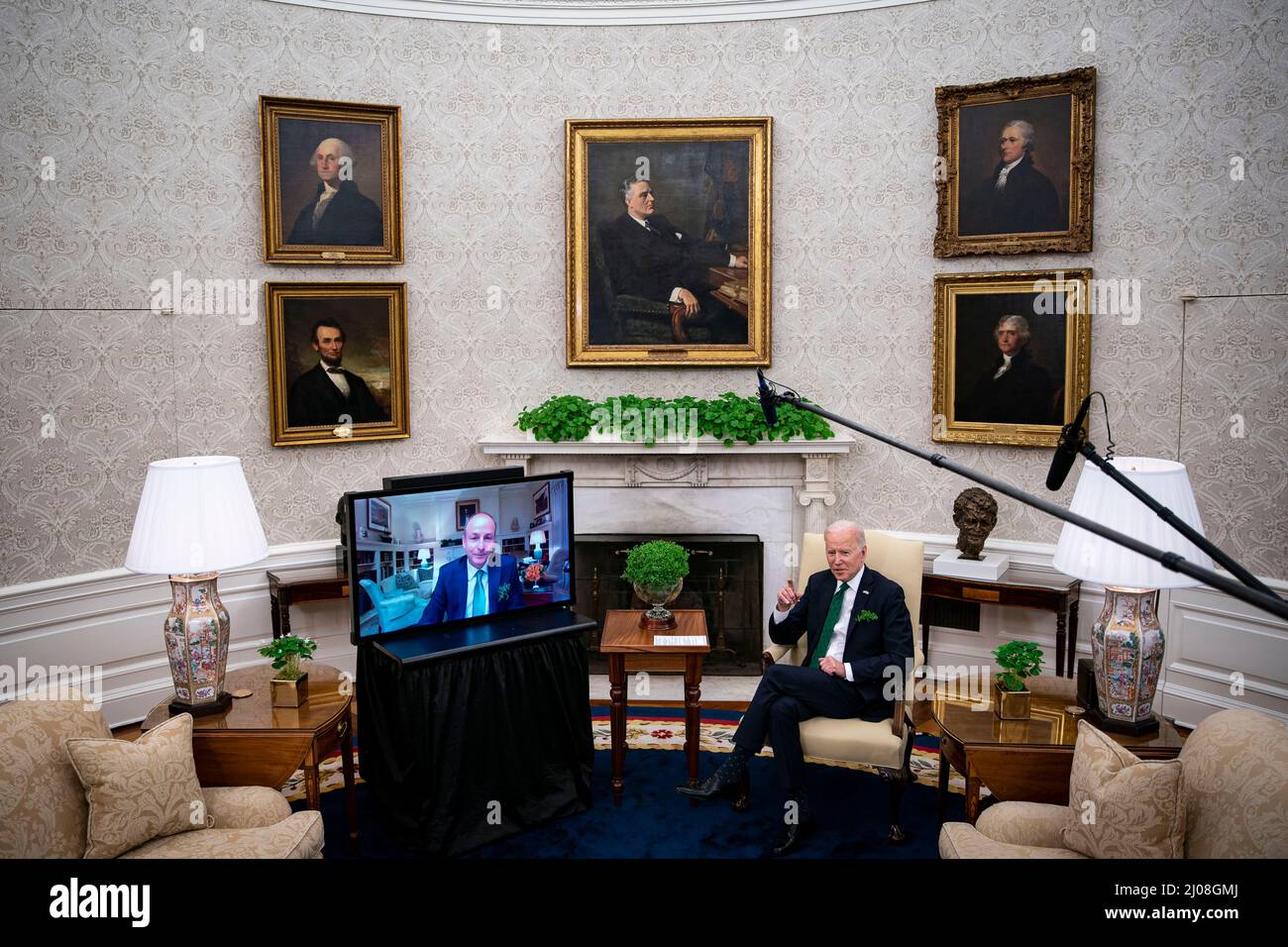Washington, USA. 17th Mar, 2022. U.S. President Joe Biden, left, and Micheal Martin, Ireland's prime minister, right, meet virtually in the Oval Office of the White House in Washington, DC, U.S., on Thursday, March 17, 2022. Martin tested positive for Covid-19 while in Washington for St. PatrickÕs Day celebrations. Photographer: Al Drago/Pool/Sipa USA Credit: Sipa USA/Alamy Live News Stock Photo