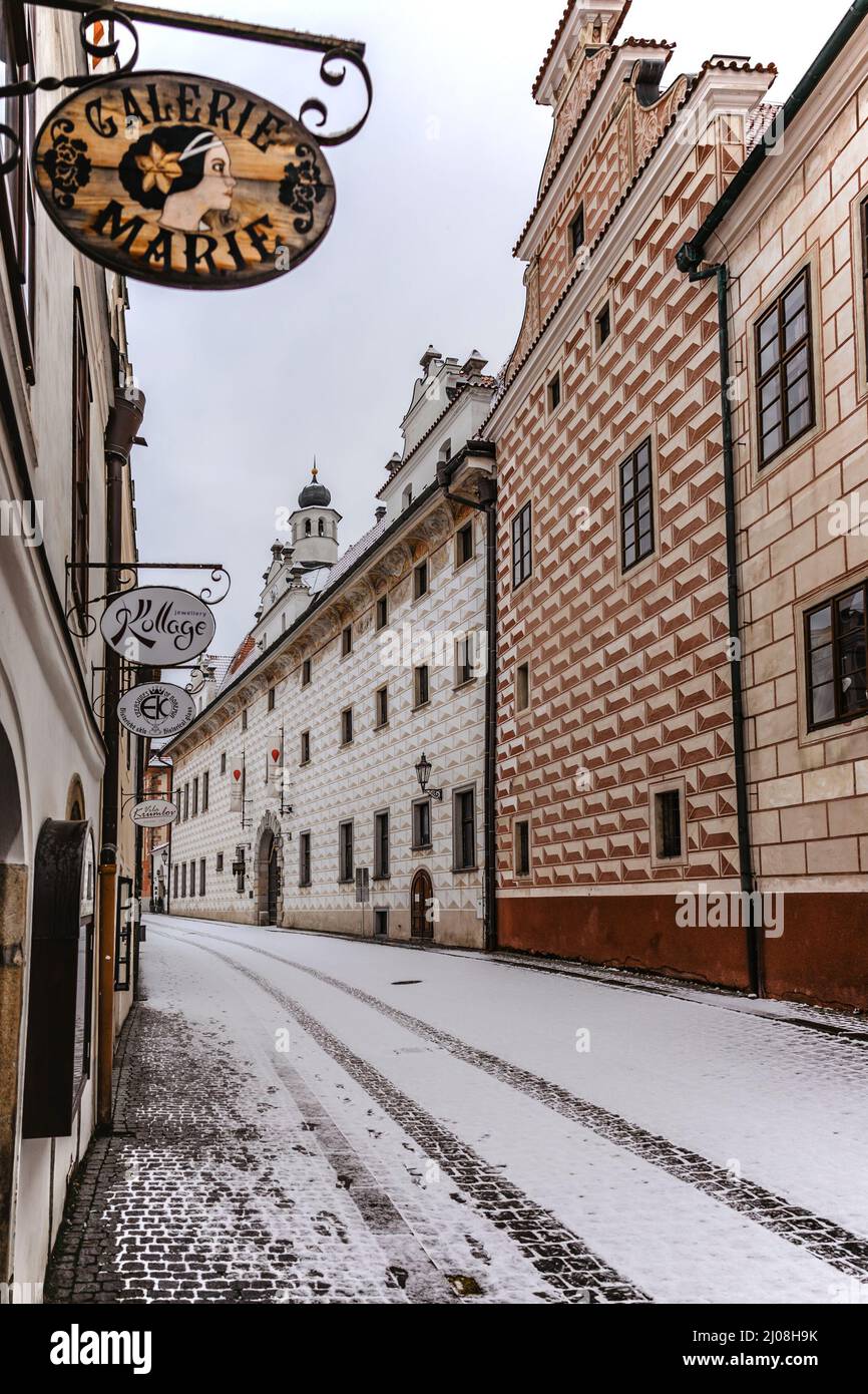 Cesky Krumlov-March 5,2022.Empty snowy street of famous Czech medieval town.Historic centre with Gothic,Renaissance,Baroque architecture.UNESCO Stock Photo