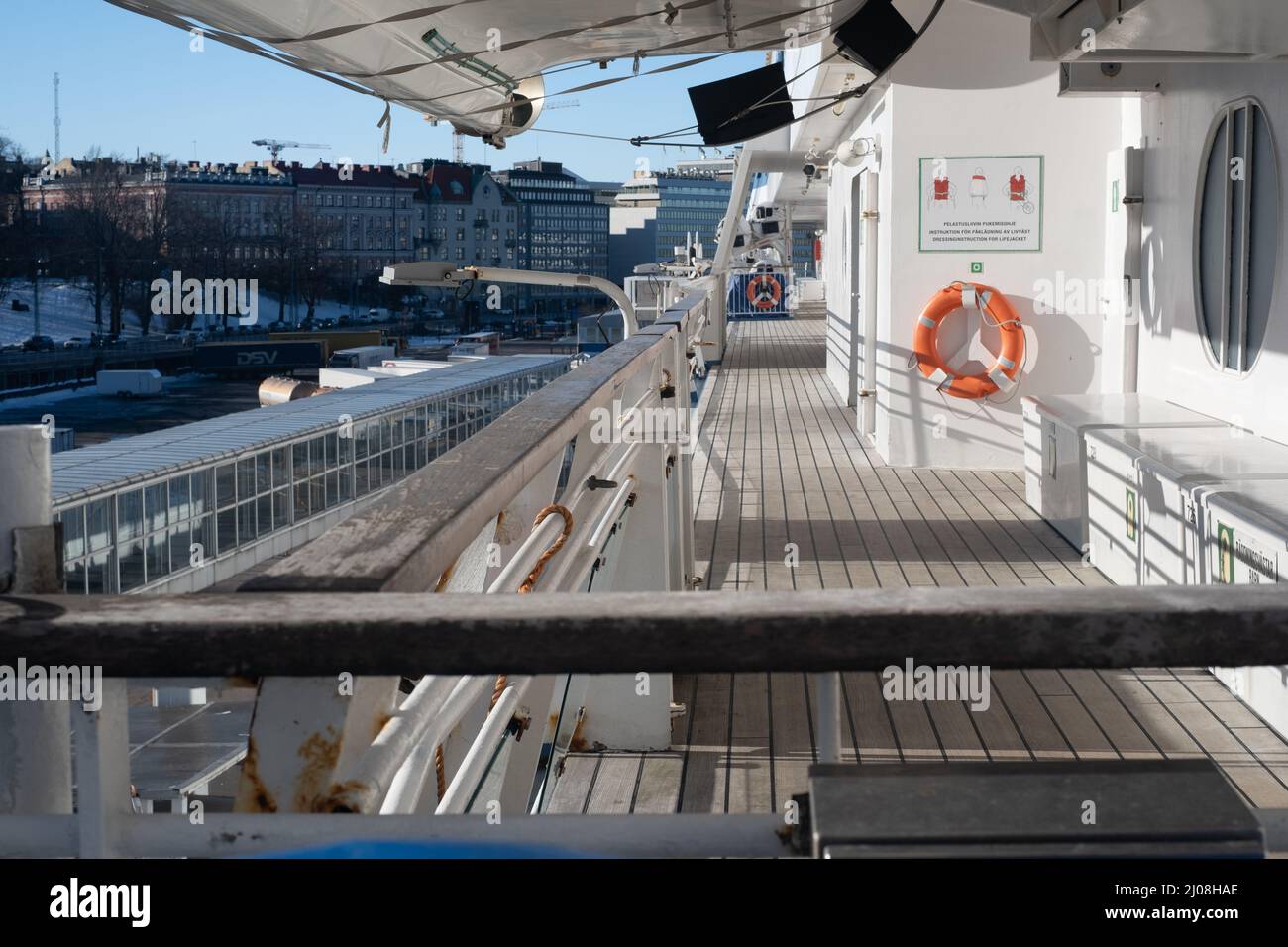 Helsinki / Finland - MARCH 14, 2022: Closeup of a liferaft of a large passenger ferry. An outside walking promenade of a cruise ship. Stock Photo