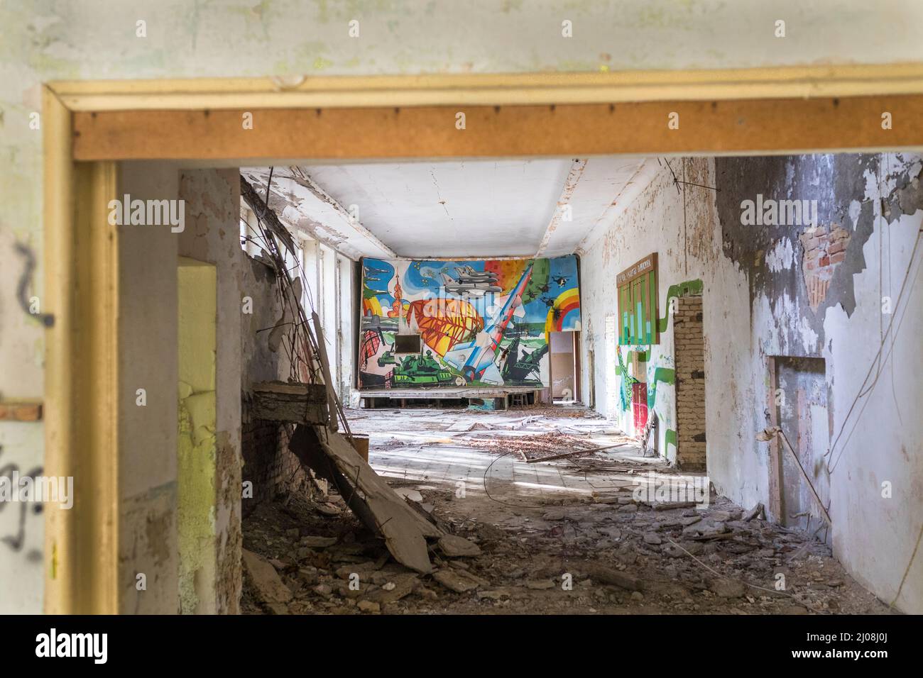 Propaganda mural art in decaying abandoned Russian army barracks in East Germany GDR Stock Photo