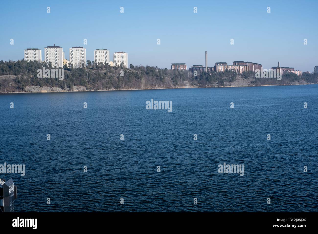 Stockholm / Sweden - MARCH 14, 2022: View of Stockholm suburban of Lidingö from across the river on a sunny day Stock Photo