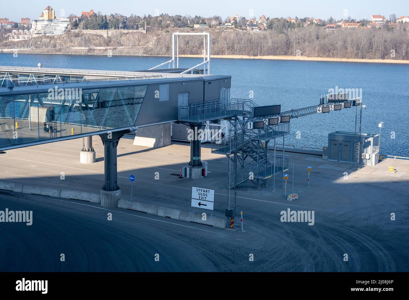 Stockholm / Sweden - MARCH 14, 2022: Closeup of an elevated passenger boarding bridge in the harbor Stock Photo