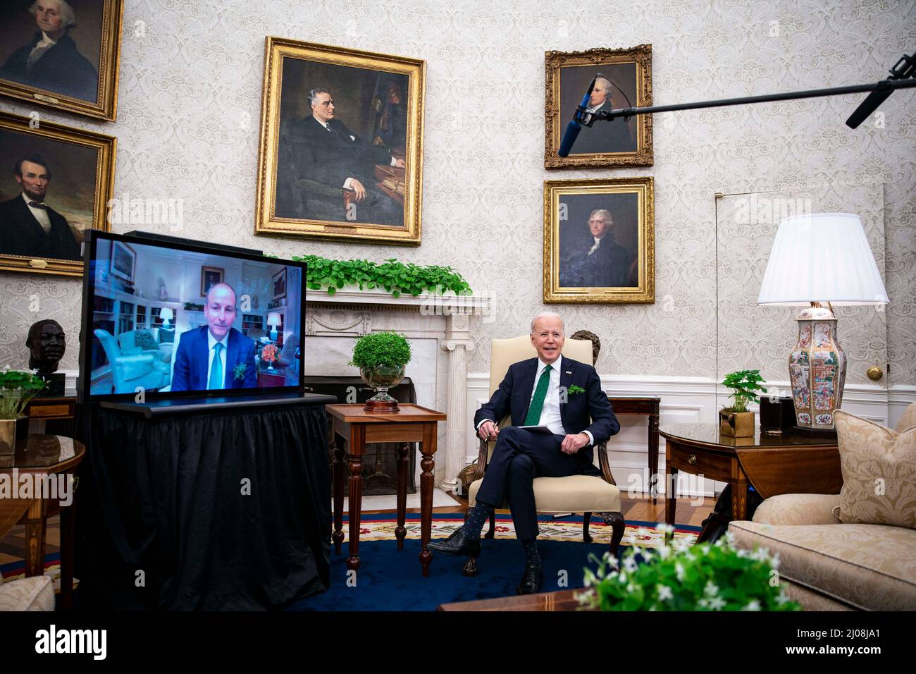 U.S. President Joe Biden, left, and Micheal Martin, Ireland's prime minister, right, meet virtually in the Oval Office of the White House in Washington, D.C., U.S., on Thursday, March 17, 2022. Martin tested positive for Covid-19 while in Washington for St. Patrick’s Day celebrations. Photo by Al Drago/Pool/ABACAPRESS.COM Stock Photo