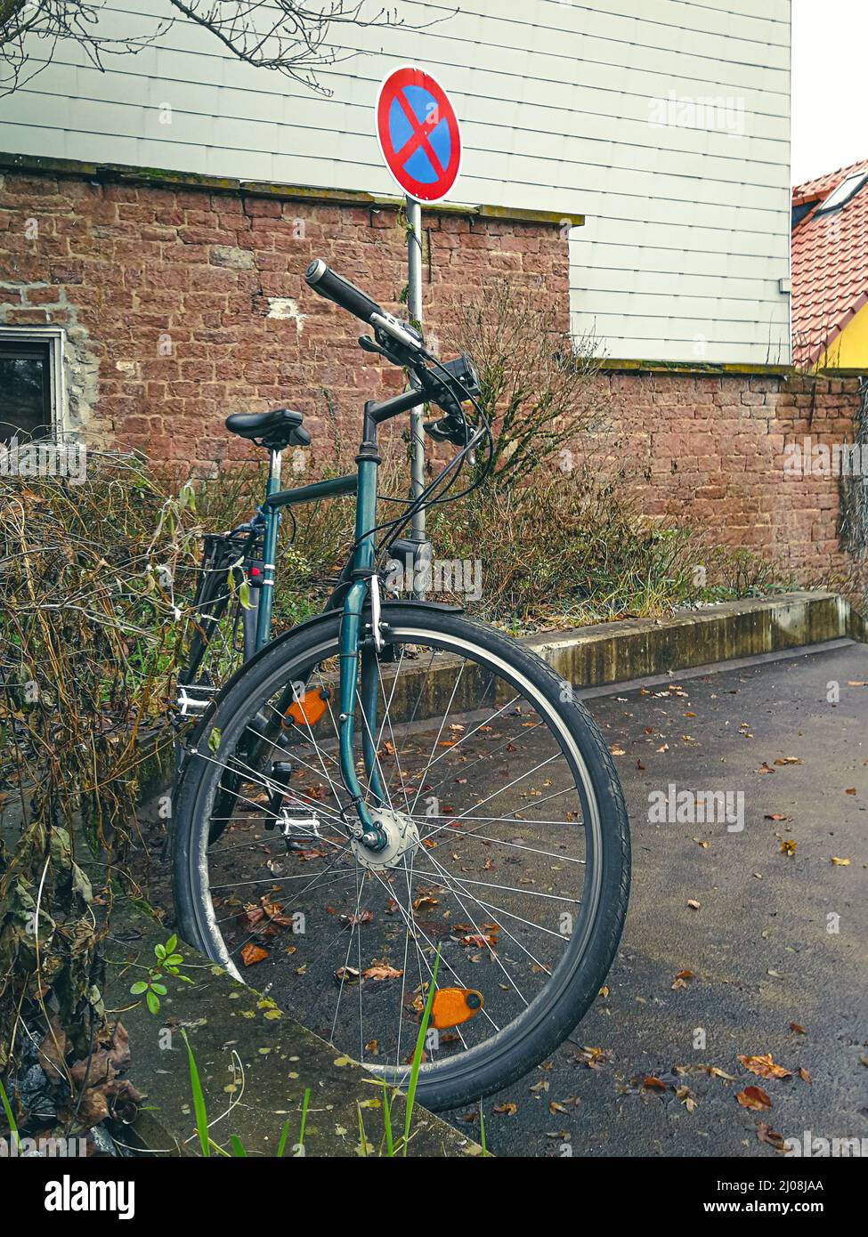 Bicycle parked in an no-stopping zone. symbolic image of parking space management problems Stock Photo