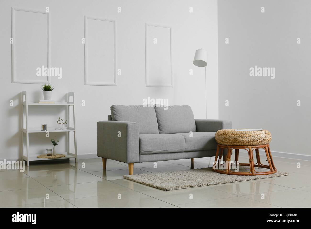 Interior of modern living room with stylish sofa and table Stock Photo ...
