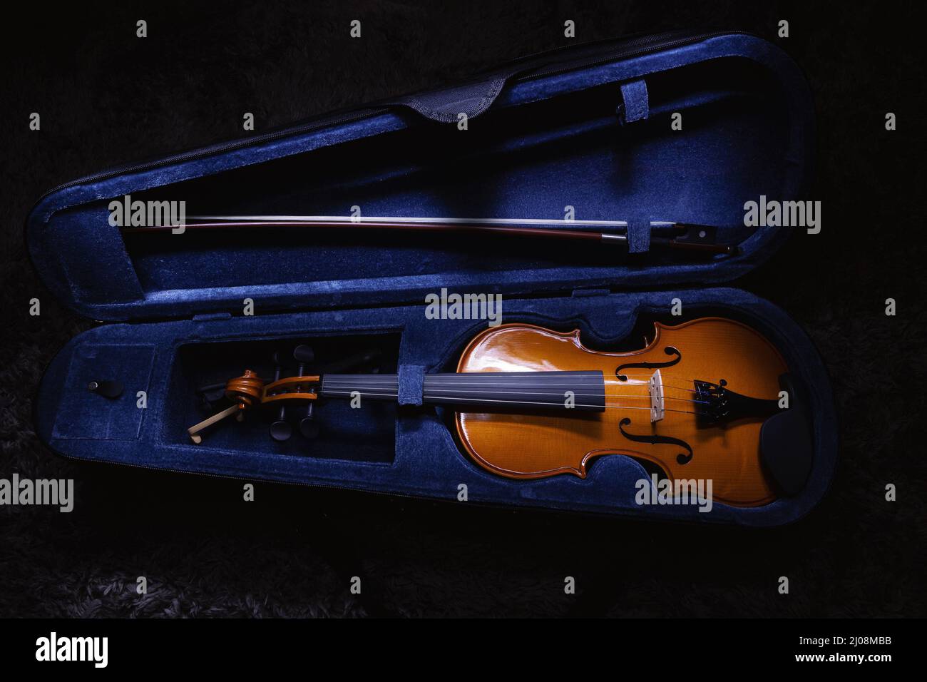 Closeup view on small violin, one half size, view on details. Stock Photo