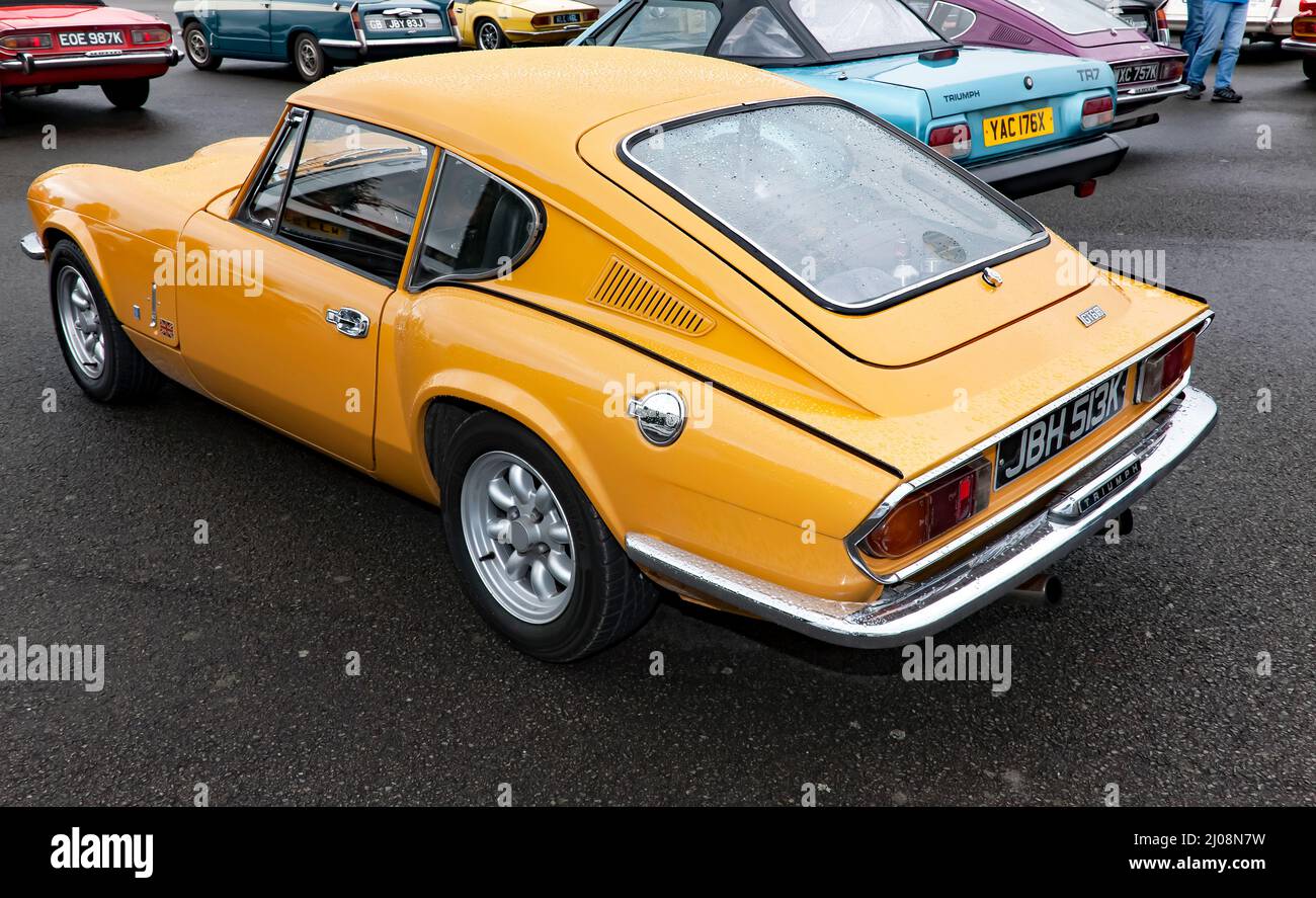 Three-quarter rear view of a Yellow, 1972, Triumph Spitfire Mk GT6 Mk3, on display at the 2021 Silverstone Classic Stock Photo