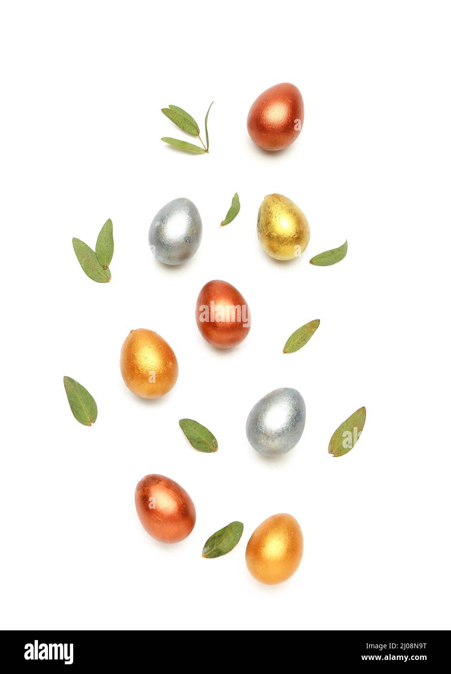 Stylish painted Easter eggs and green leaves on white background Stock ...
