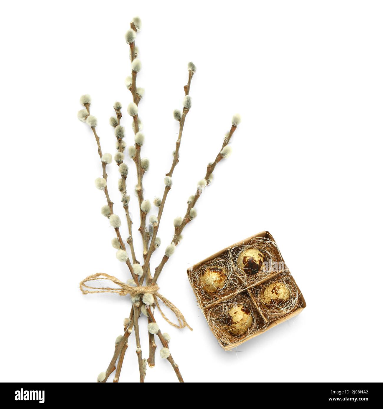 Box with Easter quail eggs and willow branches on white background ...
