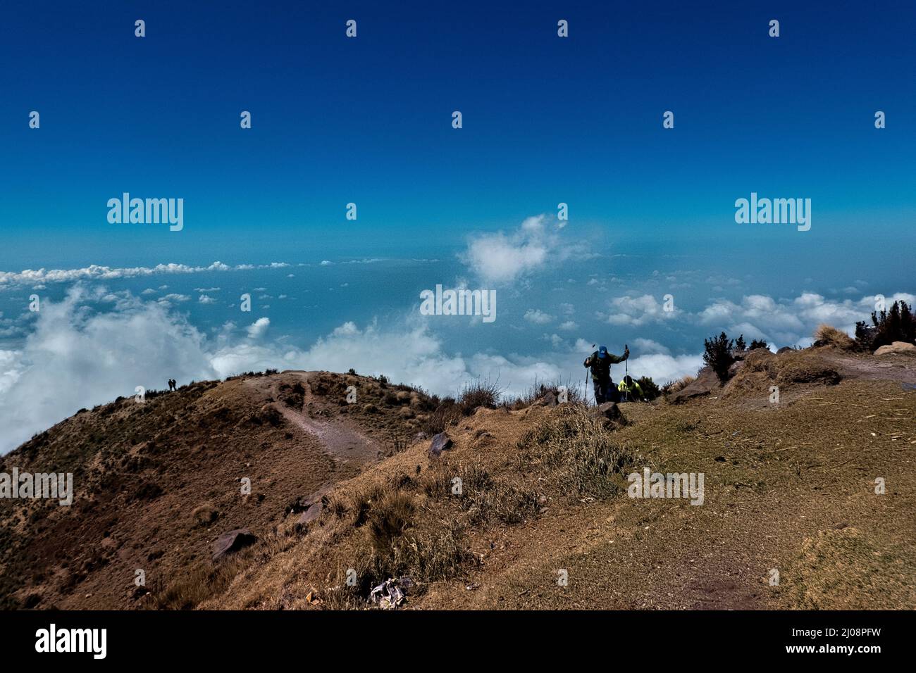 Hiker in the clouds on Santa Maria volcano, Quetzaltenango, Guatemala Stock Photo