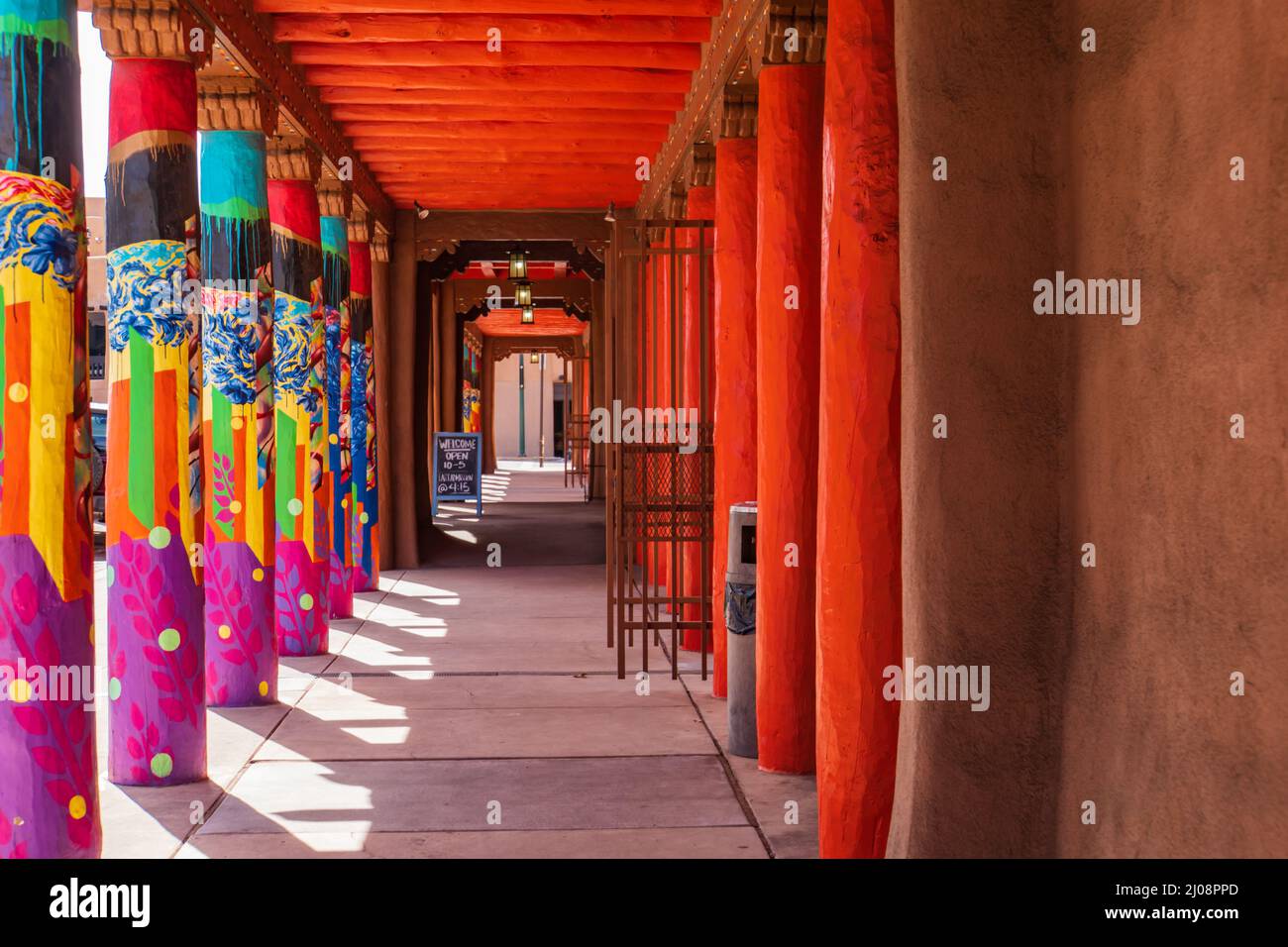 colorfully painted columns on the plaza in Santa Fe, New Mexico Stock Photo