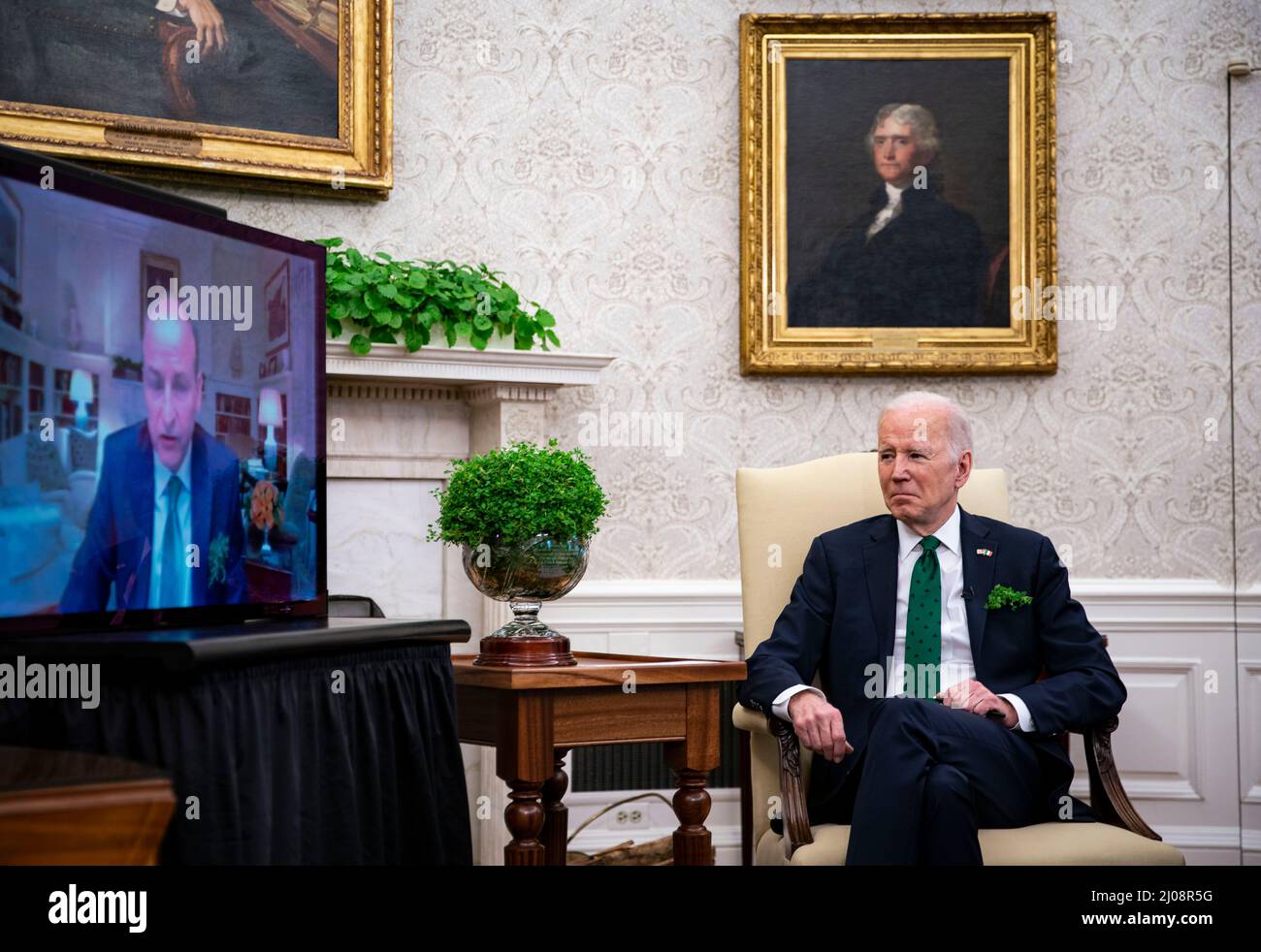 Washington, USA. 17th Mar, 2022. U.S. President Joe Biden, left, and Micheal Martin, Ireland's prime minister, right, meet virtually in the Oval Office of the White House in Washington, DC, U.S., on Thursday, March 17, 2022. Martin tested positive for Covid-19 while in Washington for St. Patrick's Day celebrations. (Photographer: Al Drago/Pool/Sipa USA) Credit: Sipa USA/Alamy Live News Stock Photo