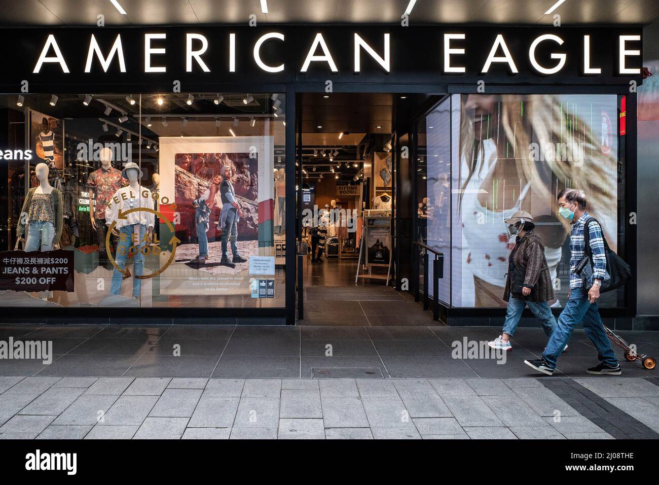 Hong Kong, China. 16th Mar, 2022. Shoppers wearing surgical masks walk by  an American Eagle store in the Central Business District of Hong Kong.  According to the Hong Kong Government's economic analysis,