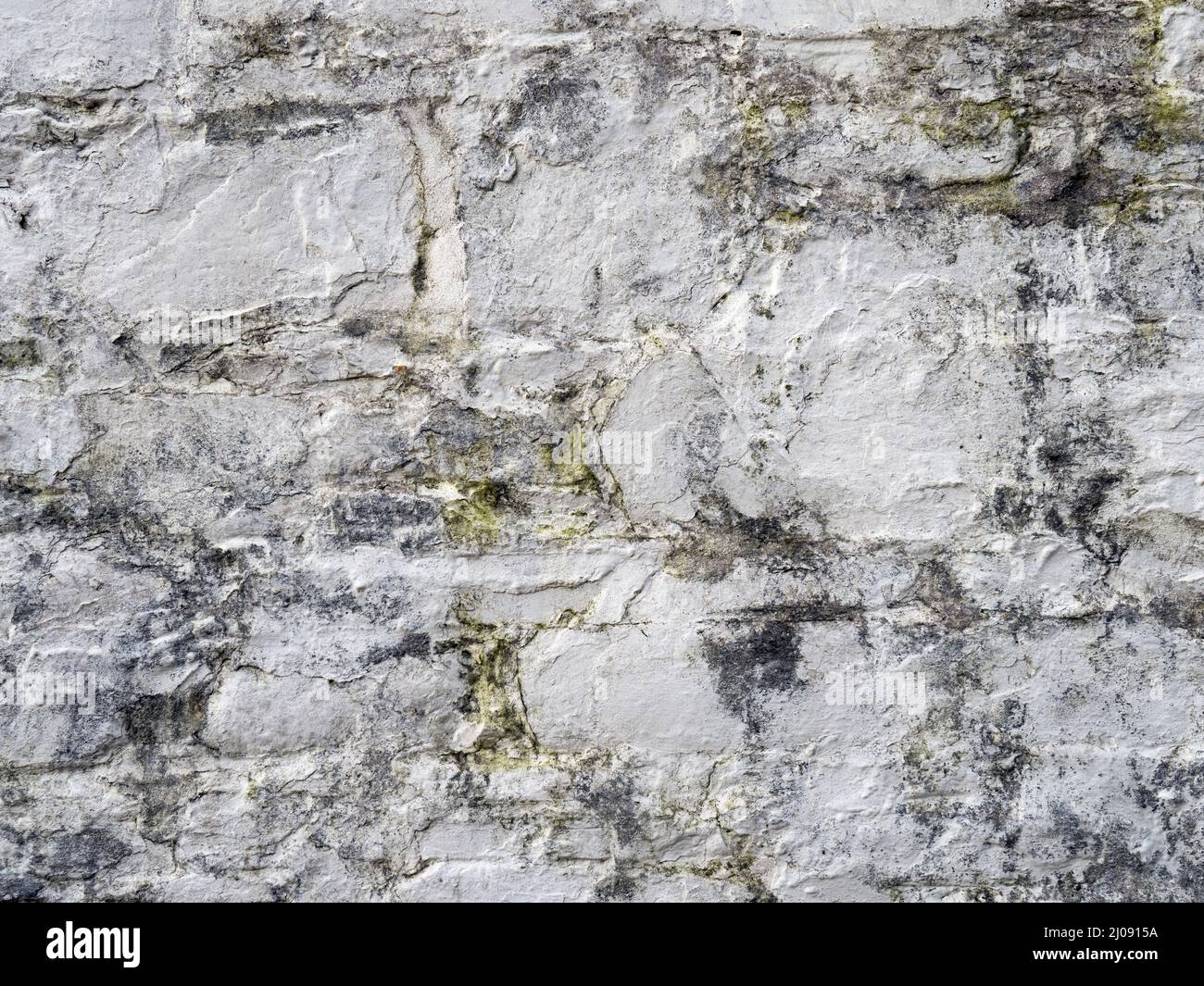 Old white, painted stone wall background. Stock Photo