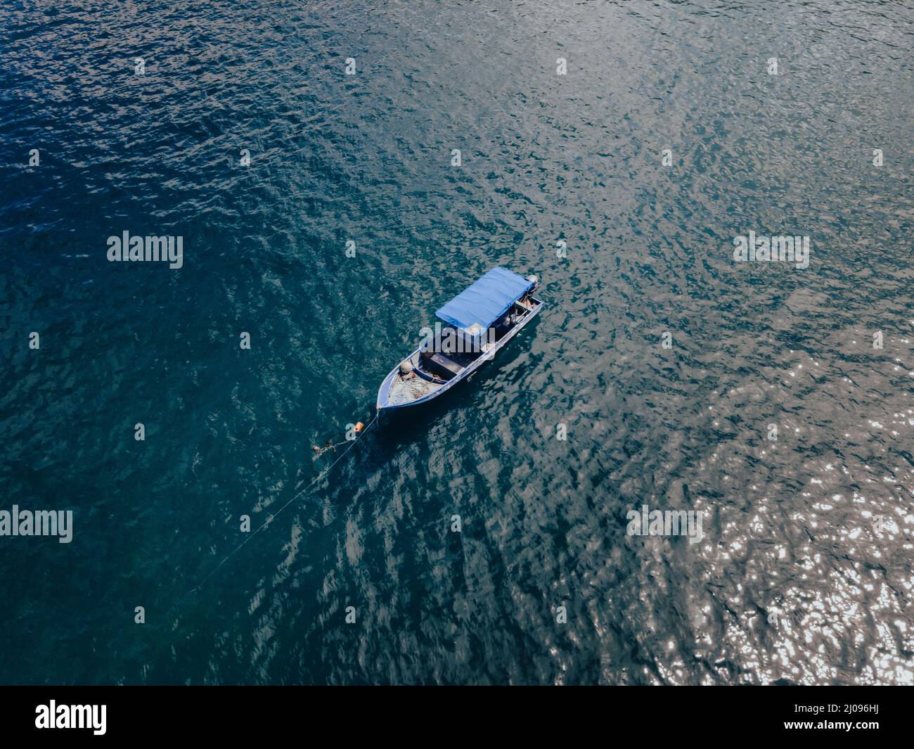 Aerial view of a yacht sailing in the ocean Stock Photo - Alamy