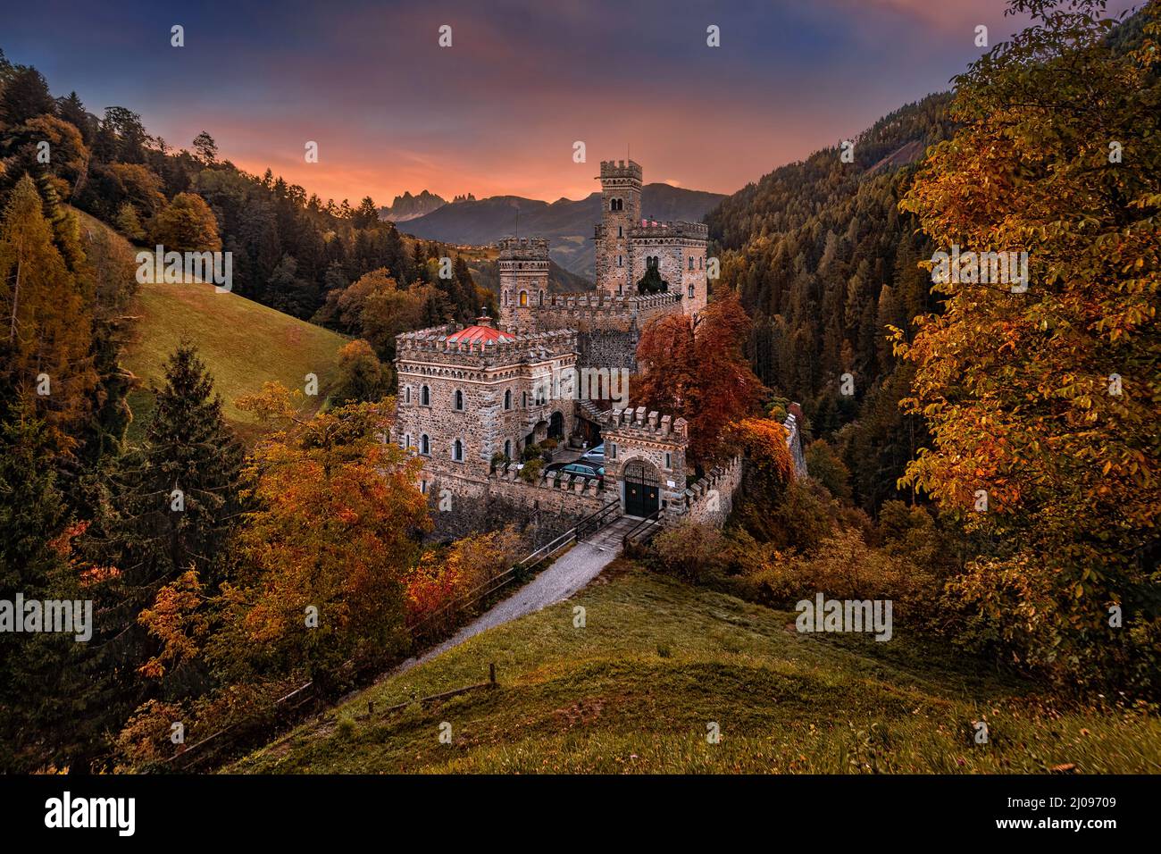 Latzfons, Italy - Beautiful autumn scenery at Gernstein Castle (Castello di Gernstein, Schloss Gernstein) at sunrise in South Tyrol with colorful sky Stock Photo