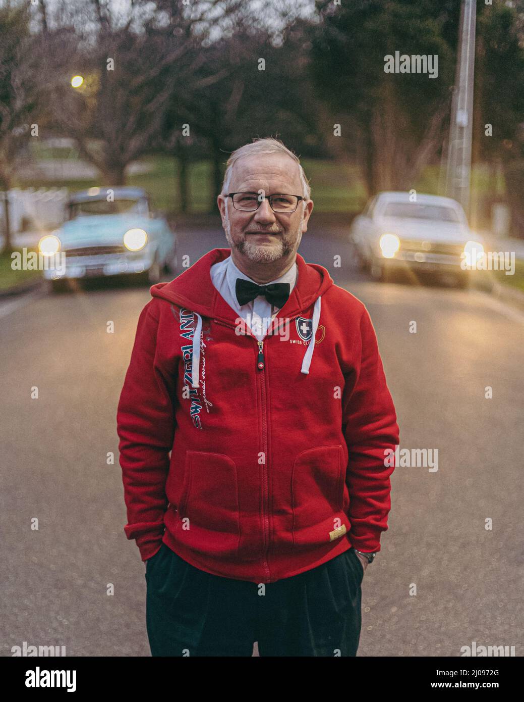 Portrait of an old Holden car collector with his cars Stock Photo