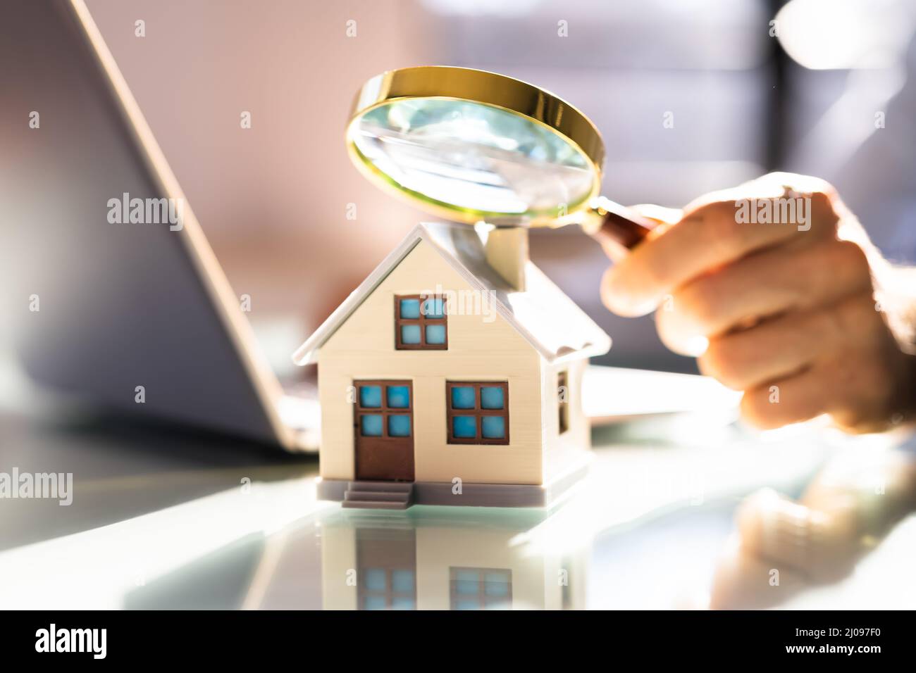 Real Estate House Inspector Checking Property Using Magnifying Glass Stock Photo