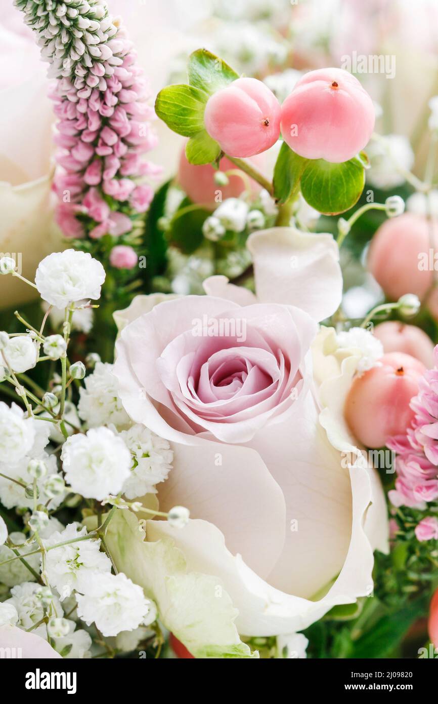 Bouquet of flowers with pink roses and hypericum coco casino. Festive