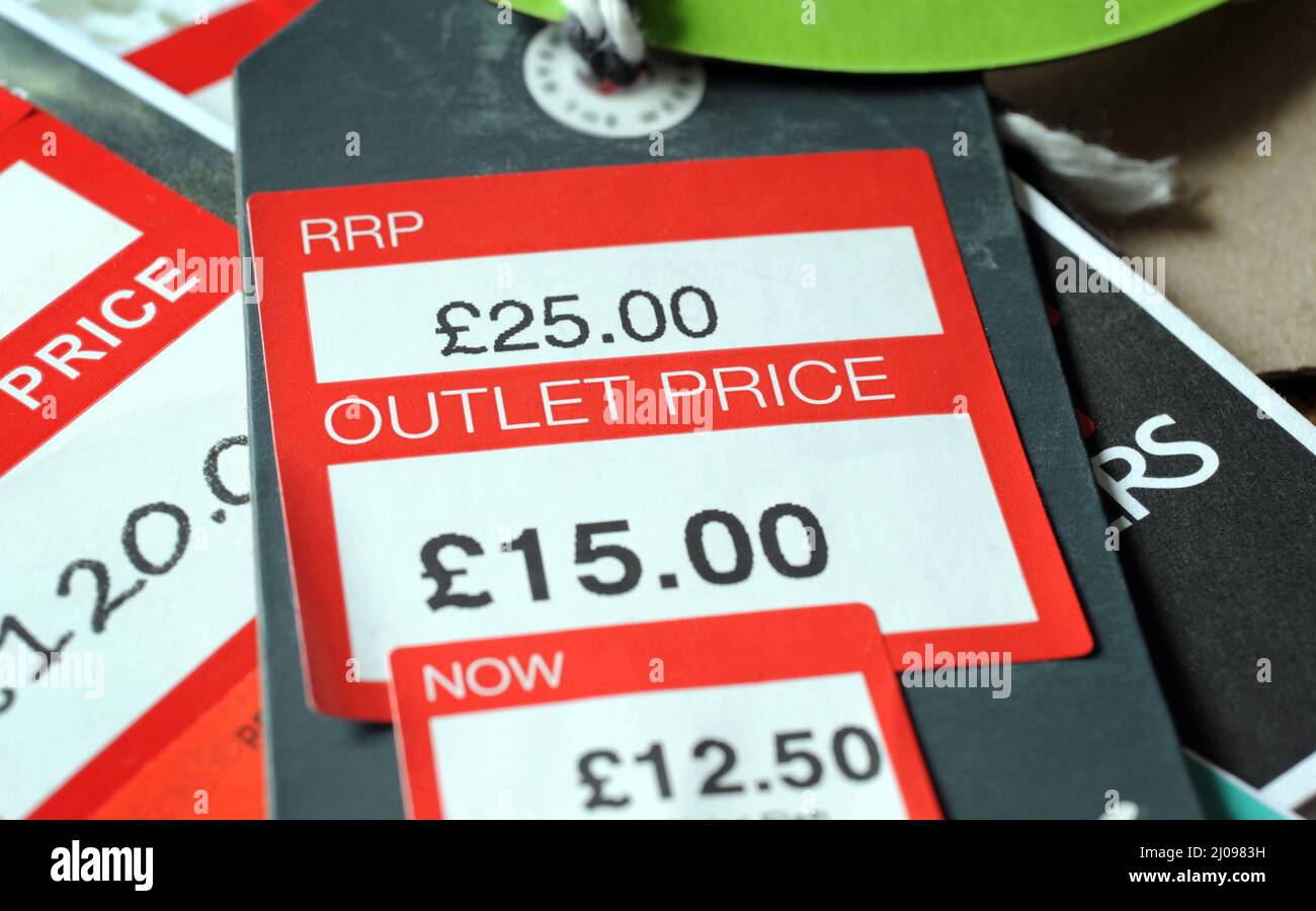 REDUCED CLOTHING PRICE TAGS RE THE ECONOMY RRP OUTLET PRICES CONSUMER GOODS SALES THE HIGH STREET ETC UK Stock Photo