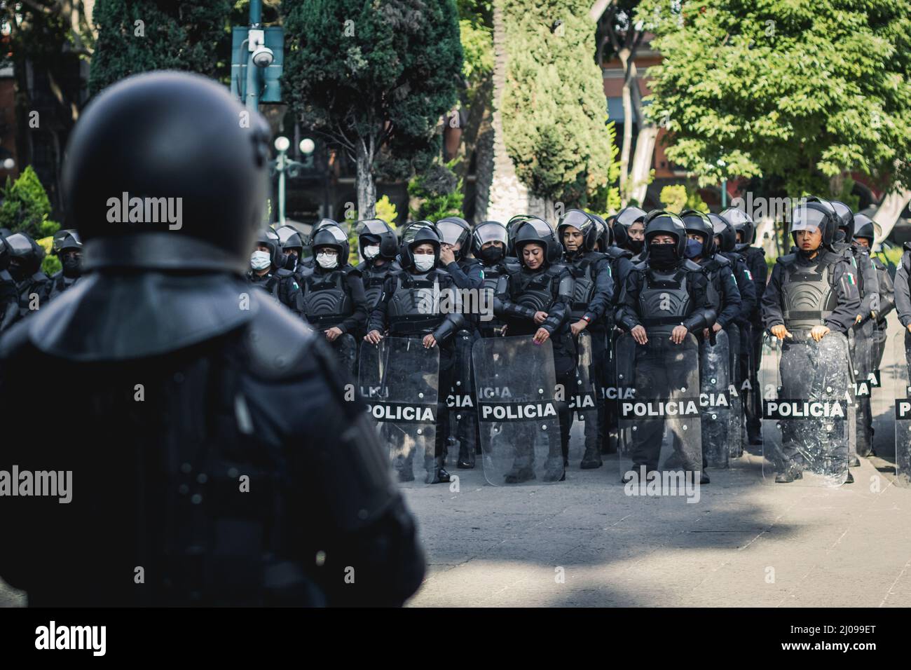 female police officers prepare to repress feminist protesters for ...