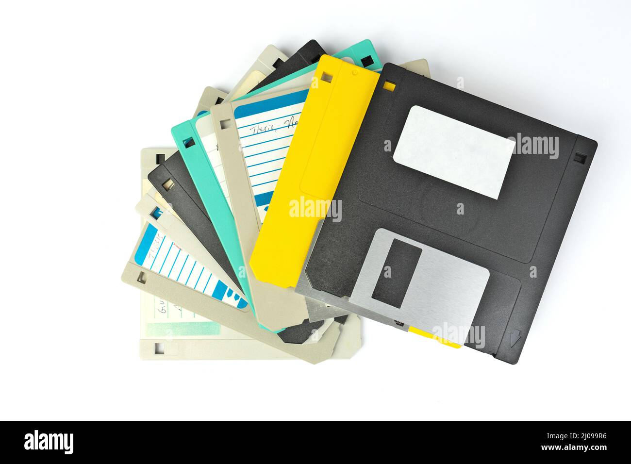 A pile of 3.5 Inch Floppy disks for background. Retro digital storage technology. Stock Photo