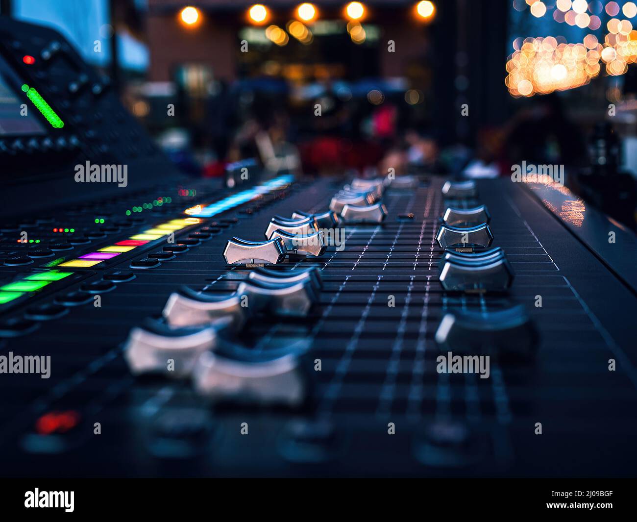Closeup of a music mixing console Midas, M32 at Camp North End with a bokeh  lights in the background Stock Photo - Alamy