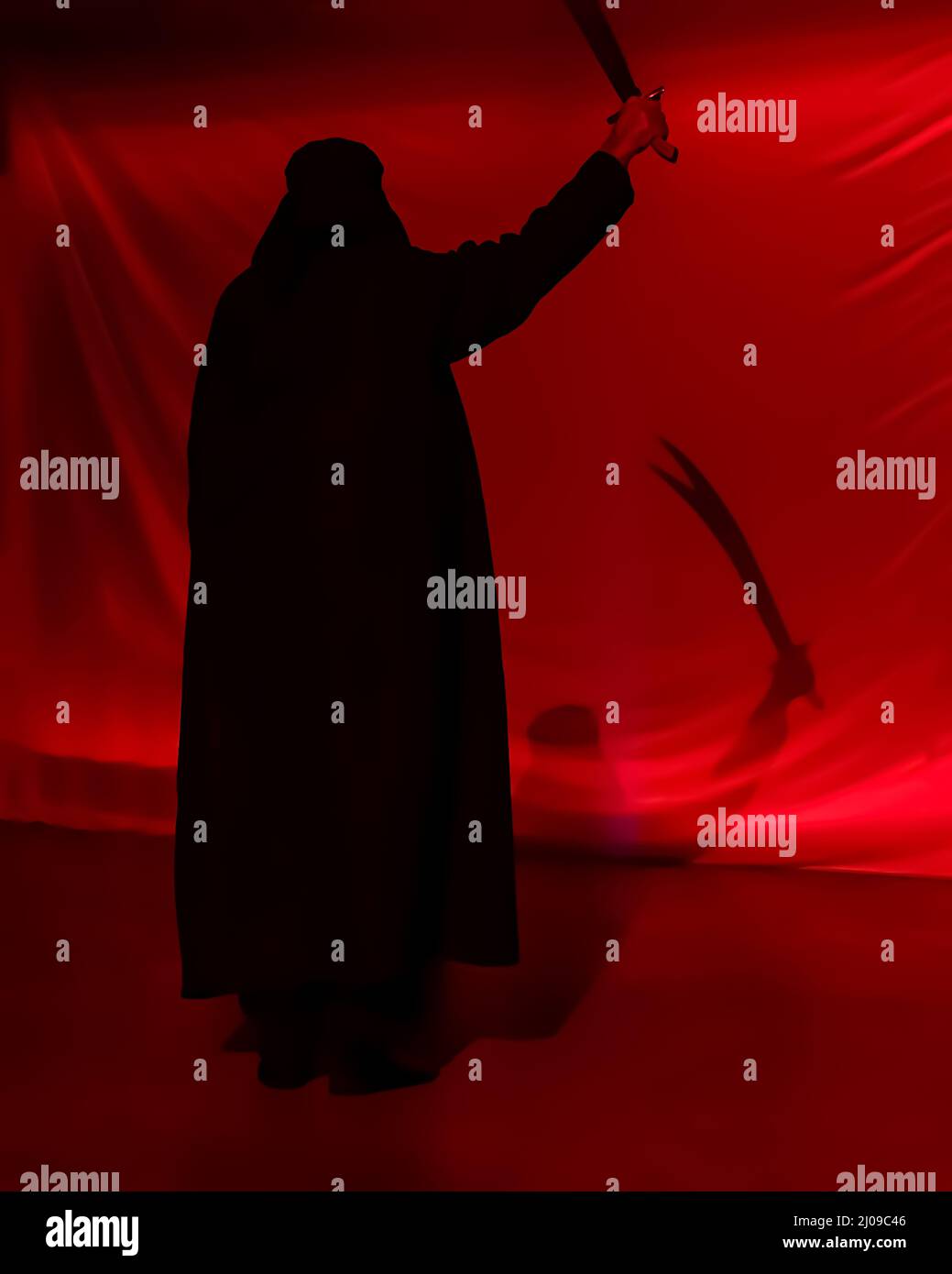 Silhouette of man with shadow of zulfikar in his hand reflected on the wall. A silhouette representing religious historic figure Imam Ali. Stock Photo