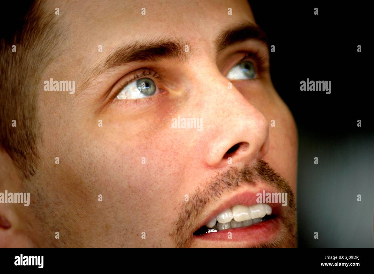 face of 30s Man with goatee and blue eyes at a family gathering with  relatives and short hair Stock Photo - Alamy