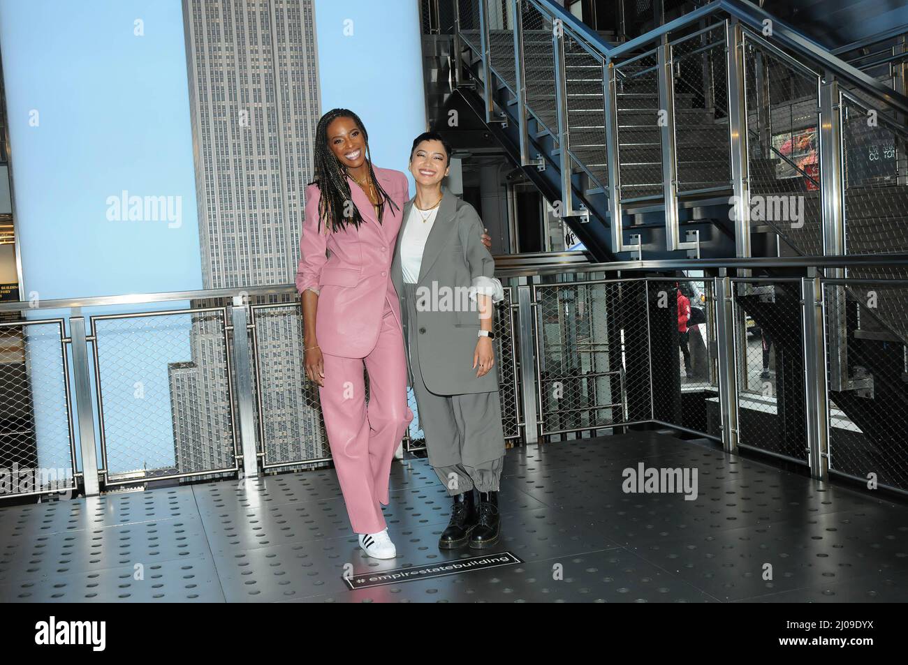 New York, USA. 17th Mar, 2022. (From left) Zainab Johnson and Andy Allo  visit the Empire State Building to promote sci-fi comedy series 'Upload' in  New York City. Credit: SOPA Images Limited/Alamy