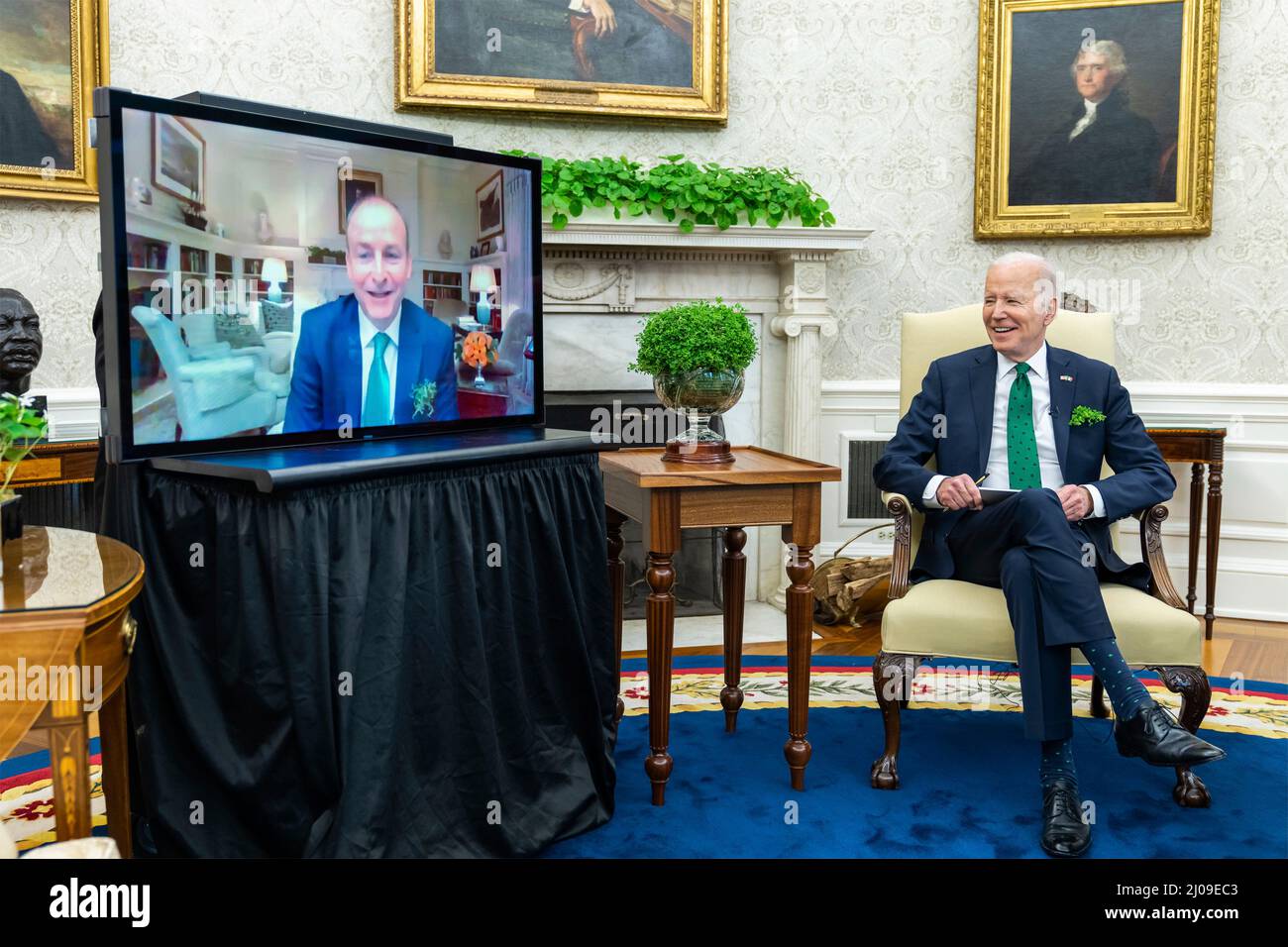 Washington DC, USA. 17th Mar, 2022. Washington DC, USA. 17 March, 2022. U.S President Joe Biden chats with Irish Prime Minister Micheal Martin by video conference to mark St Patricks Day with the traditional bowl of shamrocks from the Oval Office of the White House, March 17, 2022 in Washington, DC The Prime Minister was unable to attend the annual event in his honor after testing positive for COVID-19. Credit: Adam Schultz/White House Photo/Alamy Live News Stock Photo