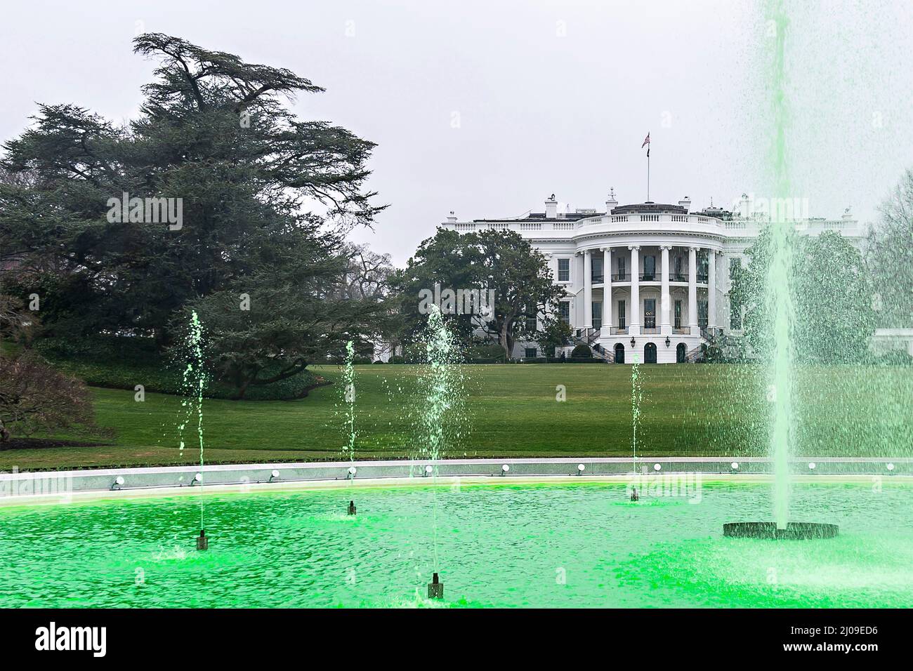 Washington DC, USA. 17th Mar, 2022. Washington DC, USA. 17 March, 2022. The White House fountain is died green to celebrate St Patricks Day on the South Lawn of the White House, March 17, 2022 in Washington, DC Credit: Adam Schultz/White House Photo/Alamy Live News Stock Photo