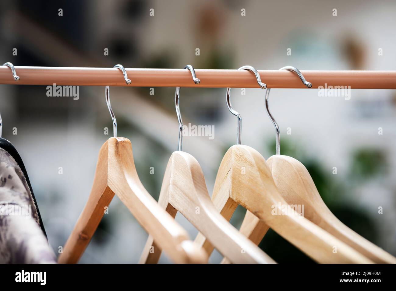 Wooden Hangers To Hang Clothes On A Light Brown Coat Rack Stock Photo Wooden Hangers To Hang Clothes On A Light Brown Coat Rack Stock Photo