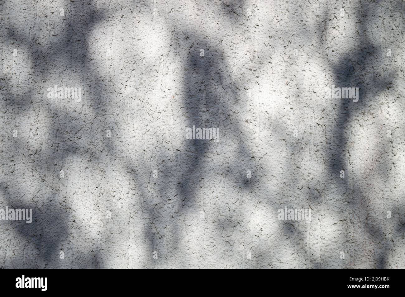 Relief exterior wall with irregular shadow on it Stock Photo
