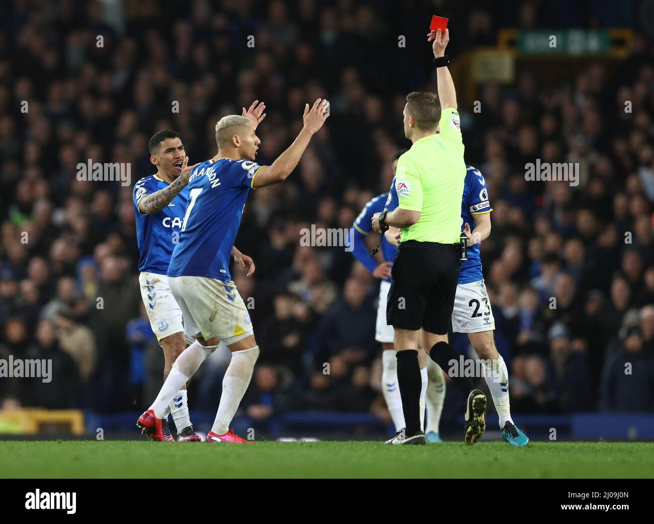 Liverpool, UK. 17th March 2022. Allan Marques Loureiro of Everton (L) is shown a red card by referee Craig Pawson during the Premier League match at Goodison Park, Liverpool. Picture credit should read: Darren Staples / Sportimage Credit: Sportimage/Alamy Live News Stock Photo