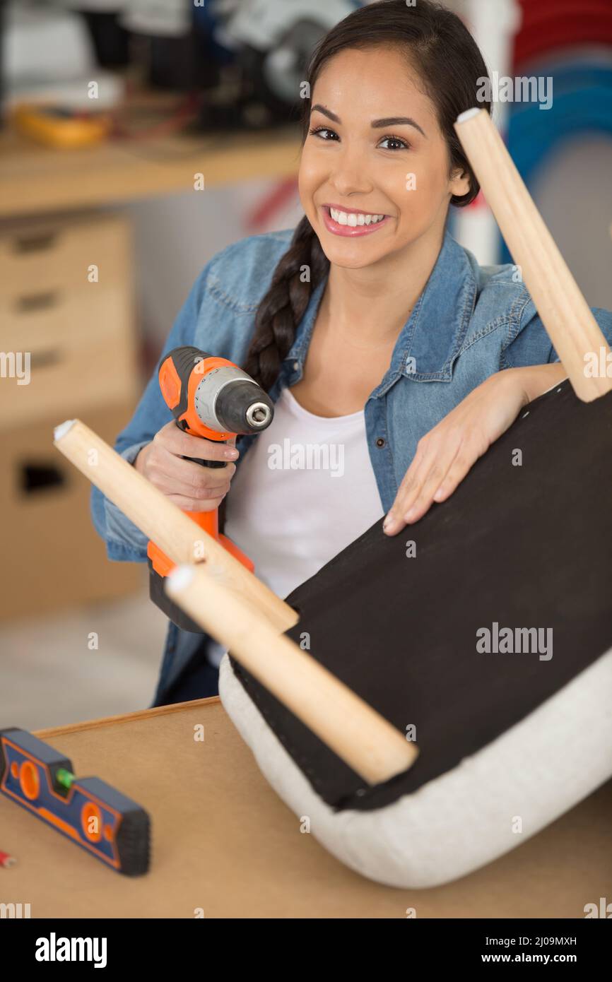 female furniture worker smiling Stock Photo Alamy