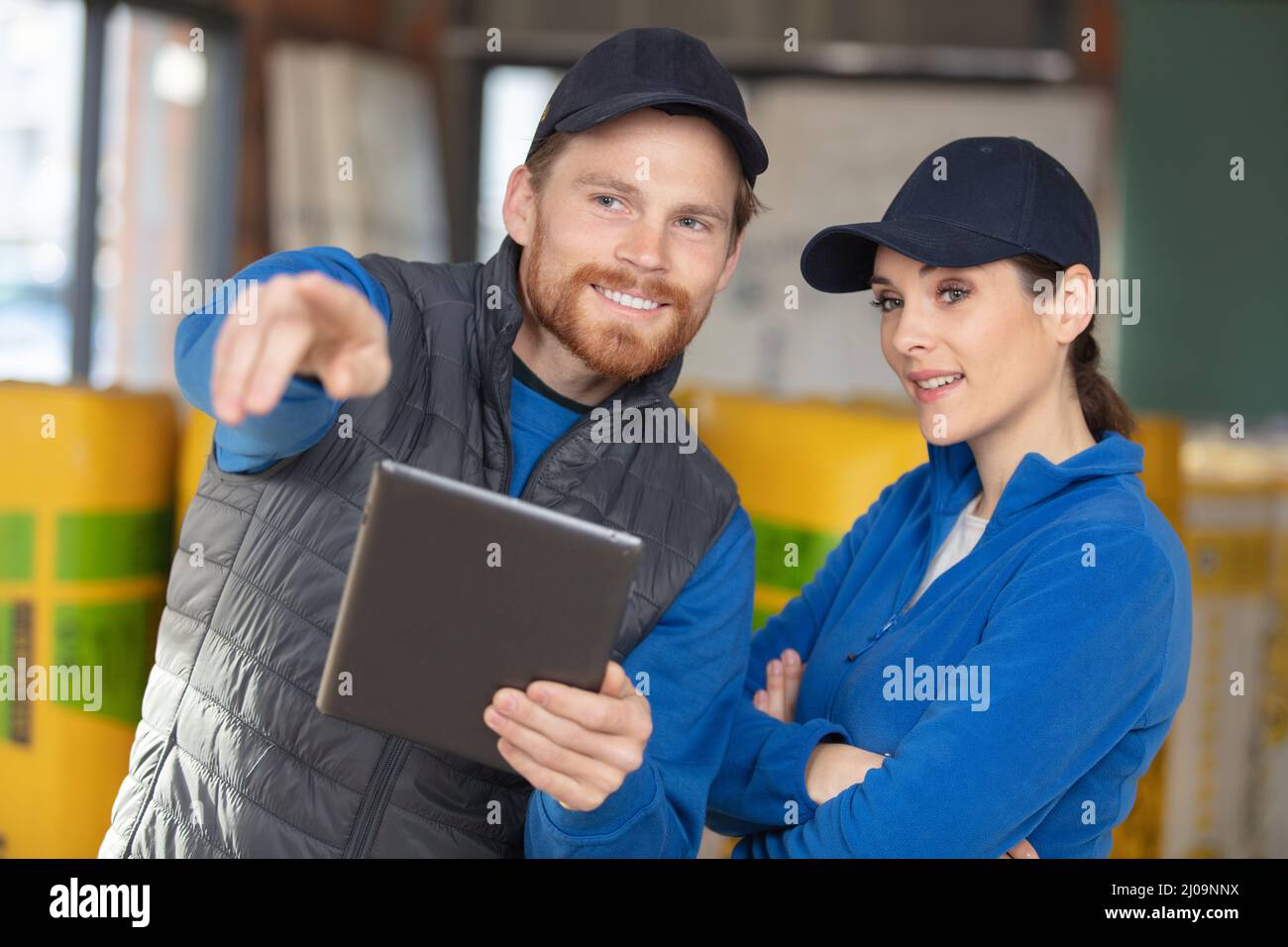 engineers working insulating building in factory Stock Photo