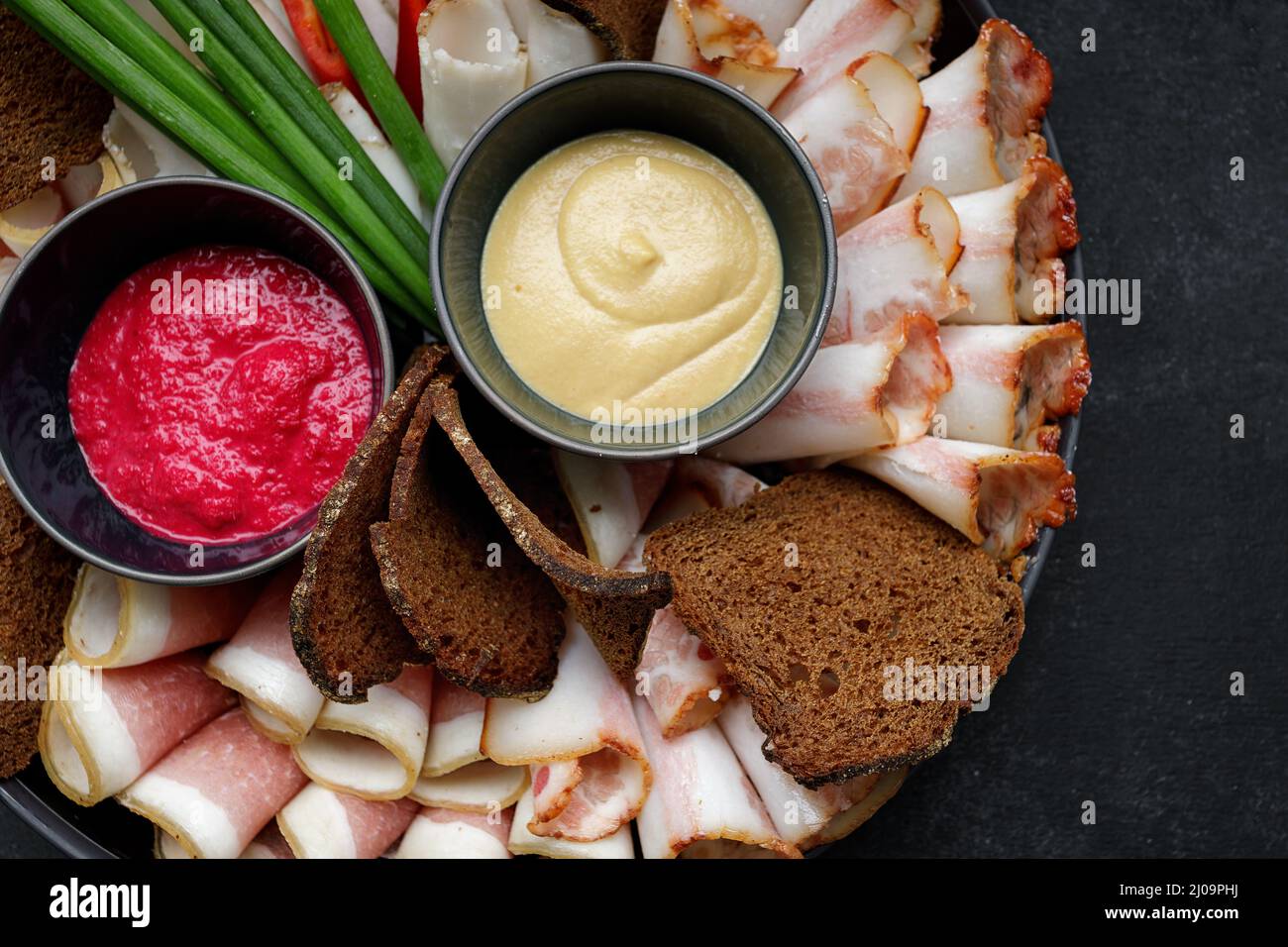 Ukrainian appetizer, salo, horseradish mustard and onion Stock Photo