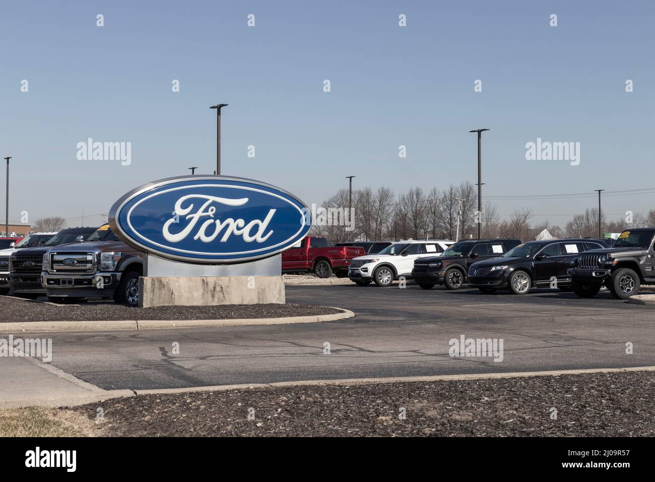 Brownsburg - Circa March 2022: Ford Motor Company logo. Ford manufactures the Mustang, Escape, Explorer and the best selling F-150 and F-Series trucks Stock Photo